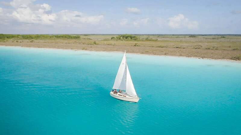 Bacalar: Group Sailing Trip with Swimming and Drinks - Cenote Esmeralda: The Main Cenote Stop and Why It Matters