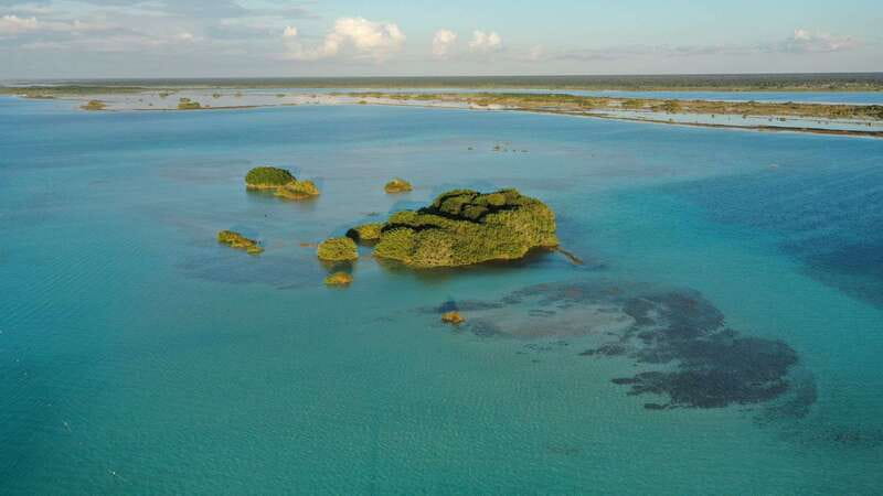 Bacalar: Group Sailing Trip with Swimming and Drinks - Drinks, Fruit, and That No-Sunscreen Sun Strategy