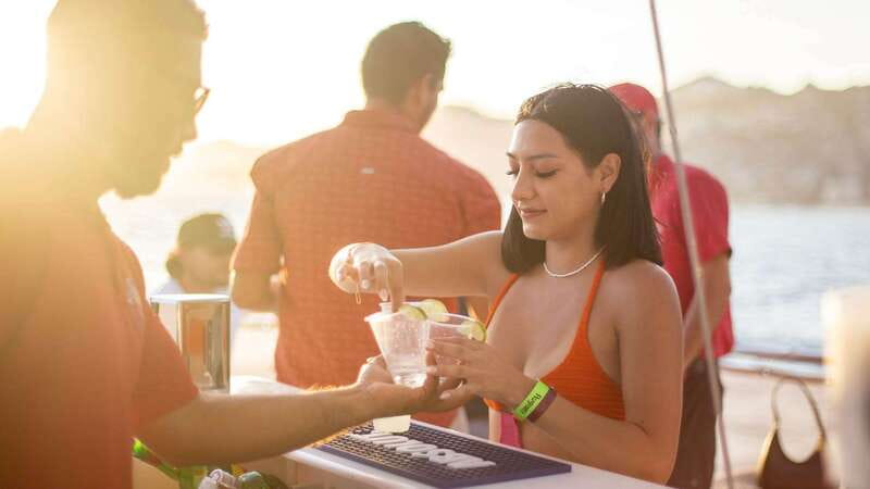 Cabo San Lucas: Sunset Party Cruise with Open Bar - From pickup to boarding: what the start feels like