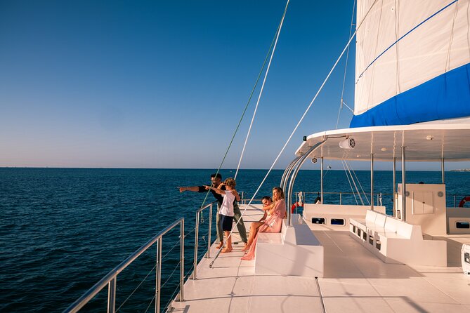 Catamaran Cruise in Riviera Maya With Snorkeling & Beach Club - On the catamaran: crew energy, drinks, and comfort on deck