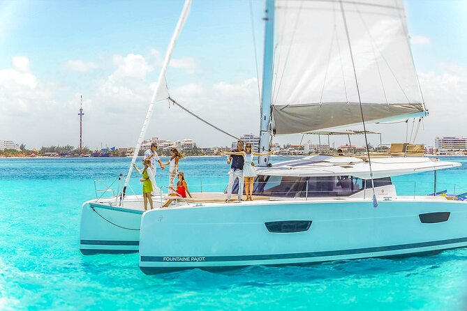 Catamaran to Isla Mujeres Snorkeling Tour with Open Bar and Lunch - Isla Mujeres Town Walk: Souvenirs Without a Full Day Charter
