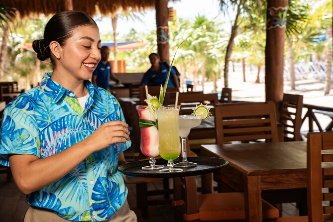 Cozumel: KUZÁ Beach Day, Buffet, Open Bar & Mexican Flavors Class - Beach time at KUZÁ: calm water, shade, and cultural entertainment