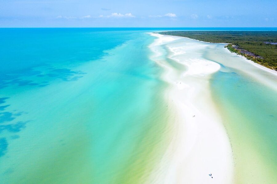 From Cancun or Puerto Morelos: Holbox Boat Tour with Lunch - From mainland cruising to Passion Island: the early scenic hits