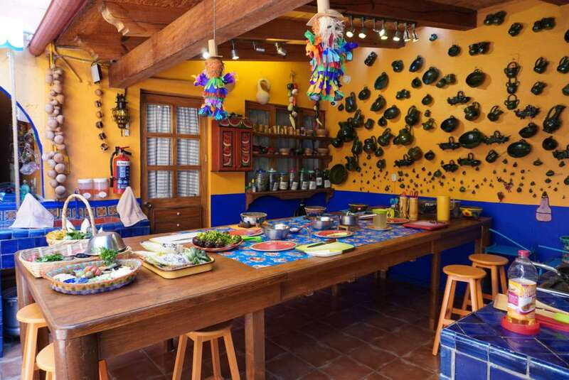 Oaxaca: Traditional Oaxacan Cooking Class with Market Visit - The meal part: tortillas, drinks, and a table that feels like Oaxaca