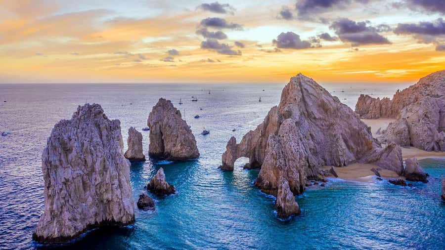 Whale Watching, Cabo San Lucas Arch, and a Trip to Playa del Amor - Arch of Cabo San Lucas: Neptune’s Finger, the Pacific Window, and the Best Photo Run